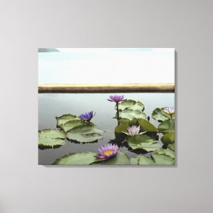 Water lilies in pond by ocean canvas print