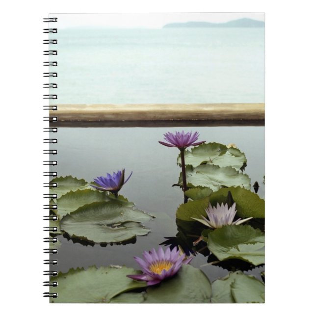 Water lilies in pond by ocean notebook (Front)