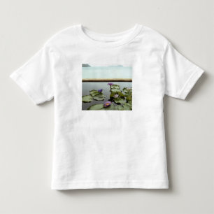 Water lilies in pond by ocean toddler t-shirt