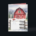 Watercolor Christmas Barn And Snowman Holiday Card<br><div class="desc">Red barn with green Christmas wreath,  snowman,  and rustic old fence in snowflakes.</div>