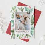 Watercolor Christmas Foliage and Holly Frame Photo Holiday Card<br><div class="desc">Happy holidays! Send holiday wishes to family and friends with this greenery holiday flat card. It features watercolor illustration of hollies,  pine needles and eucalyptus and evergreen with classic typography. Personalize by featuring your favourite photo and adding names and message. Matching items are available.</div>