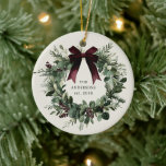 Watercolor Christmas Wreath Personalized Name Ceramic Ornament<br><div class="desc">Add holiday charm to your decor with the Watercolor Festive Christmas Wreath Personalized Family Name Ornament! Featuring a beautifully painted Christmas wreath and the option to customize with your family name, this ornament makes a perfect housewarming gift, family keepsake gift, or hostess gift. Both decorative and meaningful, it’s a lovely...</div>