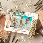 Watercolor Mele Kalikimaka Hawaiian Photo  Holiday Card<br><div class="desc">Modern holiday photo card features "Mele Kalikimaka, " the Hawaiian Christmas greeting,  with watercolor tropical foliage,  exotic hibiscus flowers,  baubles and a gold ribbon pineapple framing your favourite beach or vacation photo. All text is easily customized using the template provided.</div>
