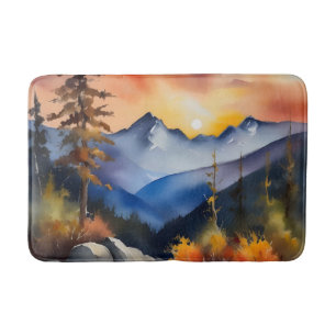 Watercolor of sunrise over snow covered mountains bath mat