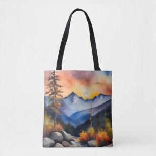 Watercolor of sunrise over snow covered mountains tote bag