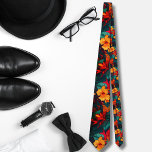 Watercolor orange Hawaiian pattern monstera Tie<br><div class="desc">The Hawaiian print men's tie showcases a captivating array of colourful tropical leaves and orange hibiscus in its design. The tie's vibrant illustration captures the lush and exotic beauty of the Hawaiian islands, bringing a burst of tropical flair to any outfit. The leaves depicted on the tie feature a variety...</div>