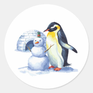 Watercolor Penguin building a snowmen Classic Round Sticker
