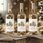 Watercolor Rustic Gnome Merry Christmas Wine Label<br><div class="desc">These cozy, rustic holiday wine labels feature a watercolor illustration of a cute female gnome seated next to a miniature Christmas tree, a basket of birch logs, and some candles. The words "MERRY CHRISTMAS" appear in grey serif letters that coordinate with the art. Add your family's name in charcoal grey...</div>