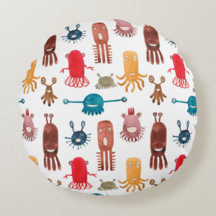 Watercolor seamless pattern of funny monsters and round pillow