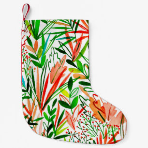 Watercolor seamless pattern with exotic leaves and small christmas stocking