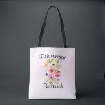 Watercolor Wildflower Bouquet Bridesmaid Wedding Tote Bag<br><div class="desc">This beautiful tote is perfect as a wedding swag bag for thanking your bridesmaids. It features a lovely hand painted bouquet of wildflowers, pansies, or violets on a pale pink watercolor background. The caption across the top reads: Bridesmaid, and there is space for her name below. Perfect for a spring...</div>