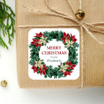 Watercolor Winter Floral Wreath Merry Christmas Square Sticker<br><div class="desc">This personalized holiday sticker features a lush watercolor floral wreath of red and ivory poinsettia flowers with winter greenery. The words "Merry Christmas" appear in dark red serif font. Personalize the design with your family name below in green italics.</div>
