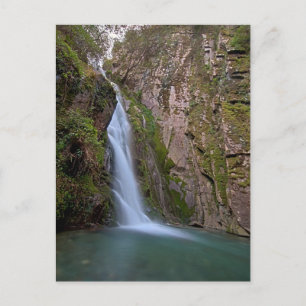 Waterfall in deep forest postcard