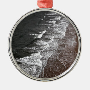 Waves breaking on a sandy beach metal ornament