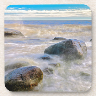 Waves crashing on shoreline rocks coaster