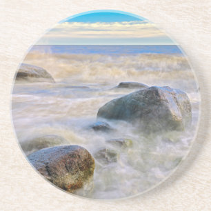 Waves crashing on shoreline rocks coaster