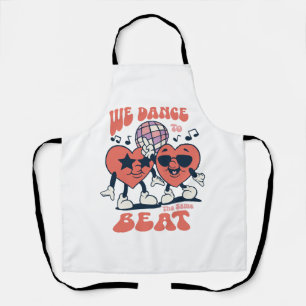 we dance to the same beat apron
