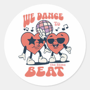 we dance to the same beat classic round sticker
