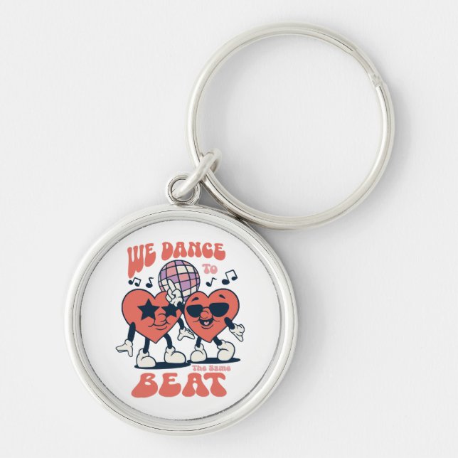 we dance to the same beat keychain (Front)