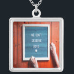 We don't deserve dogs, Animal LOVER Silver Plated Necklace<br><div class="desc">We Don't Deserve Dogs
Perfect for the animal lover in your life.  With simple text and cute dog paws on a wood floor backdrop.</div>