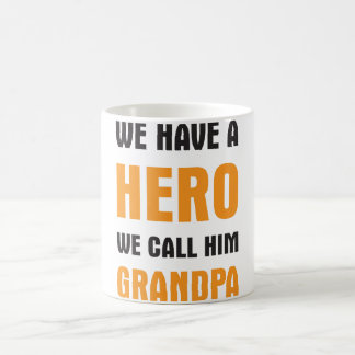 WE HAVE A HERO WE CALL HIM GRANDPA COFFEE MUG