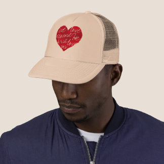 We Love Because He First Beige Trucker Hat