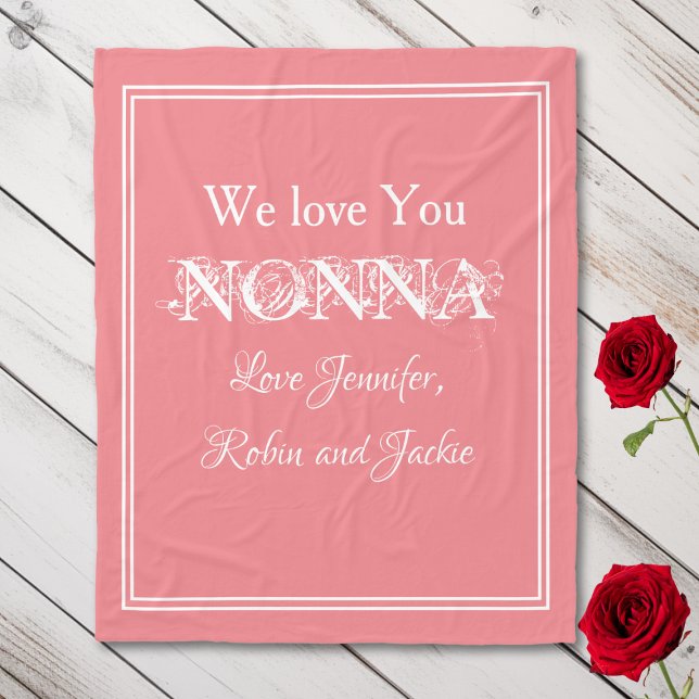"We Love You NONNA" Personalized Names Salmon Fleece Blanket ("We Love You NONNA" Personalized Names, White Script on Salmon Fleece Blanket.)