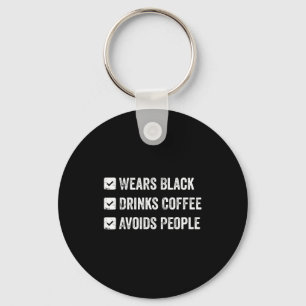Wears black drinks coffee avoids people keychain