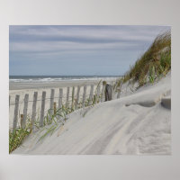 Weathered fence and sand dunes at the beach