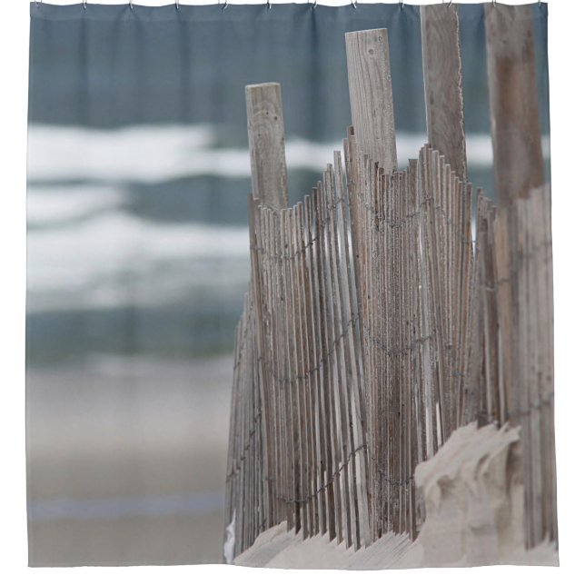 Weathered fence in the sand at the beach (Front)