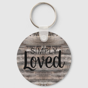 weathered wooden planks with SIMPLY LOVED Keychain