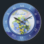 Wedding Anniversary Blue Sapphire Roman Numerals Large Clock<br><div class="desc">A lovely clock in blue sapphire tones, with Roman numerals. The frame that functions as part of the clock is also a frame for your favourite wedding photograph. Keep the sample image of blue, yellow and green Spring floral bouquet, or replace it with your own image for full personalization. Add...</div>