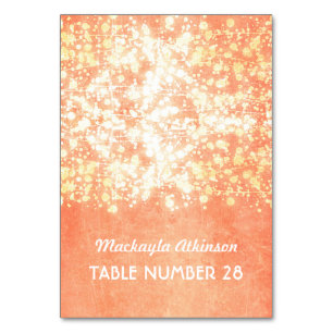 wedding escort cards string lights gold and peach