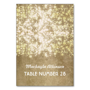 wedding escort cards string lights gold glitter