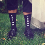 Wedding Groom Personalized Black Socks<br><div class="desc">Dress the men of your wedding party with coordinating personalized socks. "Groom" is written down the front of the socks in bold white typography. Personalize these souvenir keepsake socks with your first names and wedding date in simple white typography on the lower inside.</div>