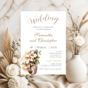 Wedding invitation with rings and white flowers
