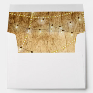 Wedding invite envelope wood and string lights