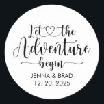 Wedding Let The Adventure Begin Classic Round Sticker<br><div class="desc">Let the adventure begin,  calligraphy script typography with connecting heart and your names and wedding day date. Stickers for gifts,  for guests and for envelope seals for your big day.</div>