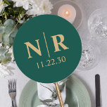 Wedding Monogram Bride And Groom Initials Classic Round Sticker<br><div class="desc">Embrace the essence of your union with our customizable wedding monogram, featuring your initials delicately entwined in a minimalist design. The striking emerald green hue symbolizes growth and harmony, while the gold accents exude luxury and opulence, making these stickers a standout addition to your wedding stationery. Whether you're sealing envelopes,...</div>