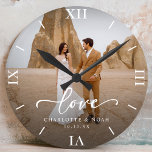 Wedding Photo Love Script Anniversary Round Clock<br><div class="desc">Celebrate love with our personalized wedding photo love script anniversary round clock,  which features an elegant script and chic modern design. This personalized photo clock beautifully displays your favourite wedding photo,  making it a timeless keepsake for newlyweds or a thoughtful wedding anniversary gift!</div>