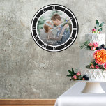Wedding Photo White Roman Numeral Black BKG Round Large Clock<br><div class="desc">A wonderful clock gift with Love is Forever font, the couple's names, and the wedding date. Personalize this with your photo and information. Clock design of the white Roman numeral clock face with a pattern for a round clock design. The black background can be changed to another colour when you...</div>