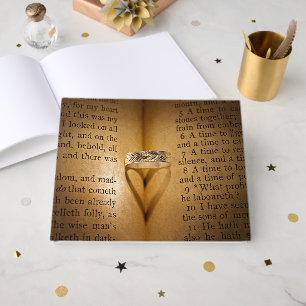 Wedding Ring Heart Shadow On Bible  Guest Book