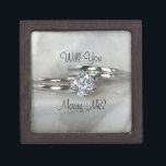 Wedding Rings on Grey Will You Marry Me Gift Box<br><div class="desc">Propose to your girlfriend and ask her to marry you with the pretty Will You Marry Me Engagement Ring Box. Personalized it with her name, if desired. Please change the text or font to suit your proposal needs. This elegant engagement gift box features a digitally enhanced photograph of a diamond...</div>