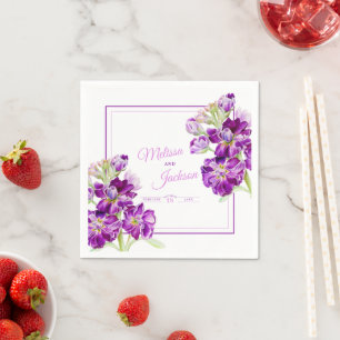 Wedding stock purple flowers on white napkin
