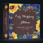 Wedding Sunflower Blue Floral Lights Photo Album Binder<br><div class="desc">This binder has been designed for wedding photos. It features a watercolor floral border design with sunflowers,  blue roses and flowers,  foliage,  string lights and a wood grain background. Personalize the names and date on the front and the text on the spine.</div>