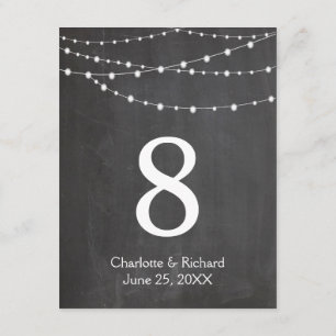 Wedding table numbers string lights and chalkboard