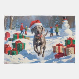 Weimaraner Running in Snow with Christmas Hat Kitchen Towel