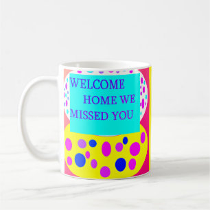 Welcome home message on coffee mug