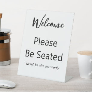 Welcome Please Be Seated White and Black Script Pedestal Sign