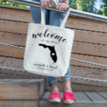 Welcome to Florida | State Silhouette Wedding Tote Bag<br><div class="desc">Give your guests a warm welcome to your Florida wedding with a bag full of snacks and treats personalized with the state where you're getting married and the bride and groom's names and wedding date. Design features "welcome" in modern handwritten calligraphy script along with bride and groom's names and wedding...</div>